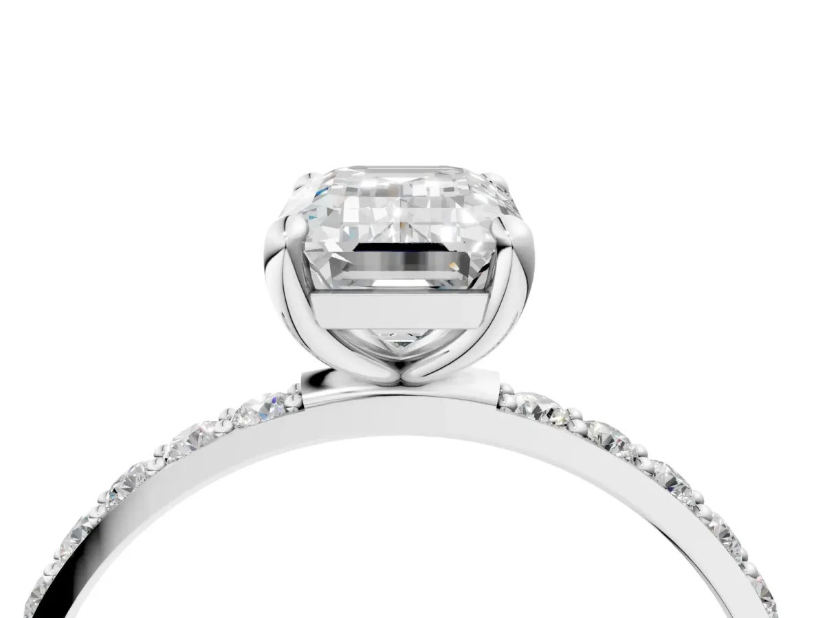 Emerald Cut Diamond Solitaire Ring with Round Pavé Band and Prong Setting Platinum