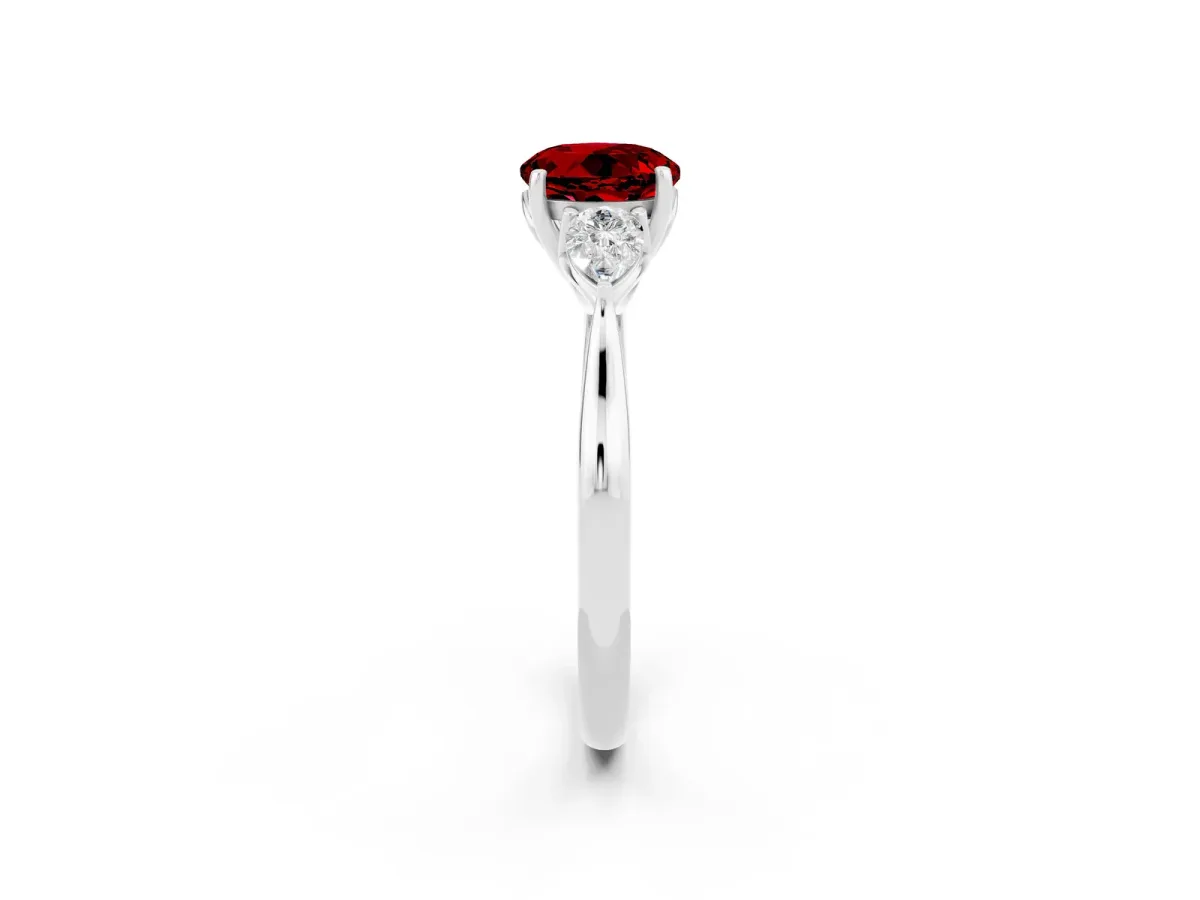 Three-Stone Round Cut Ruby Ring with Pear Side Stones in Four-Prong Setting Platinum
