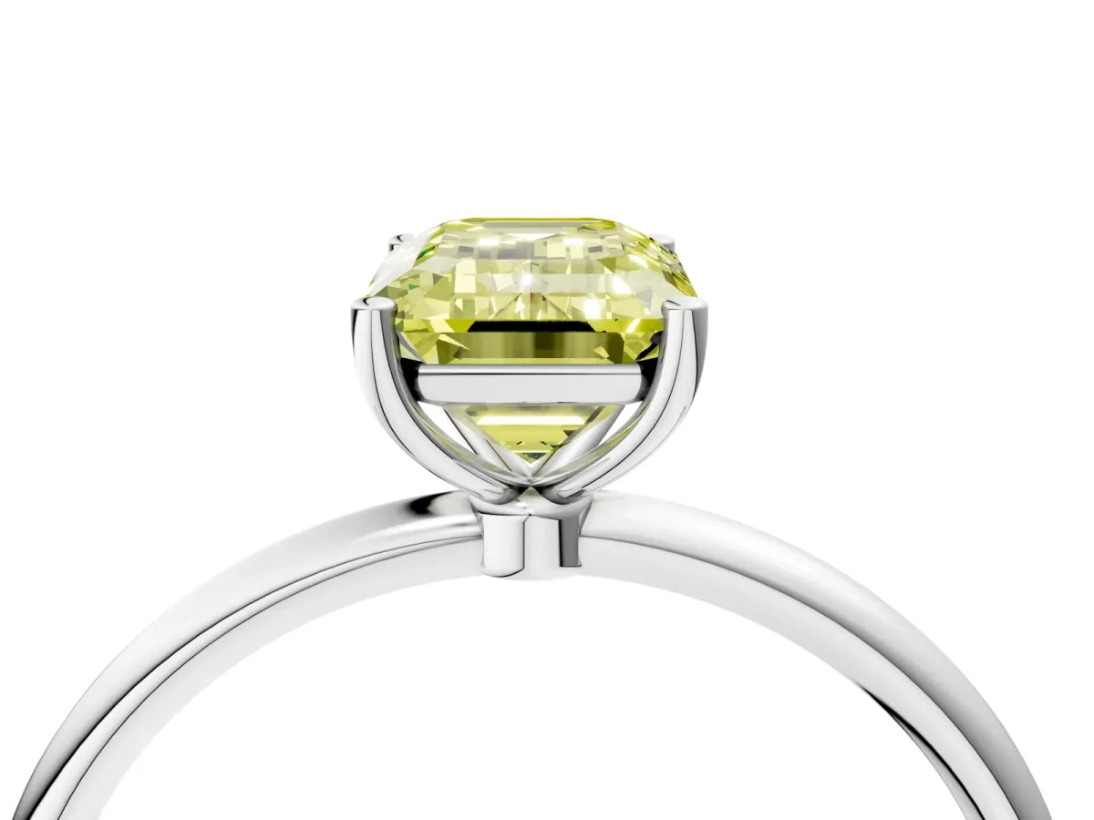 Fancy Yellow Emerald Cut Cut Solitaire Engagement Ring with Thin Band and Four-Prong Setting Silver