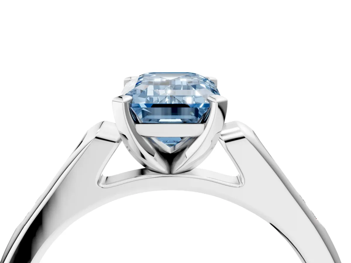 Fancy Blue Emerald Cut Diamond Solitaire Ring with Channel Set Round Band and Prong Setting Silver
