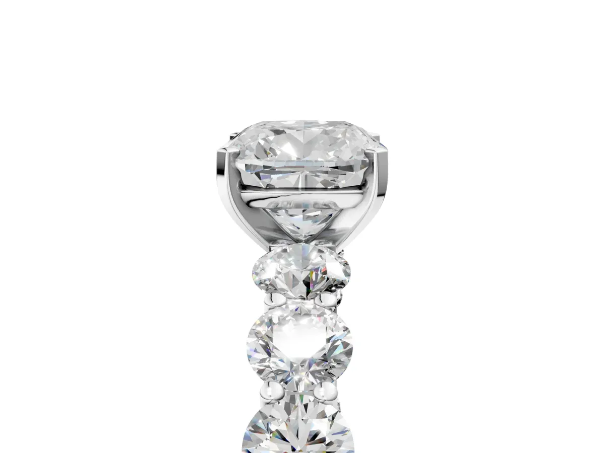 Cushion Cut Diamond Prong Setting with Side Stones on a Pave Band Platinum