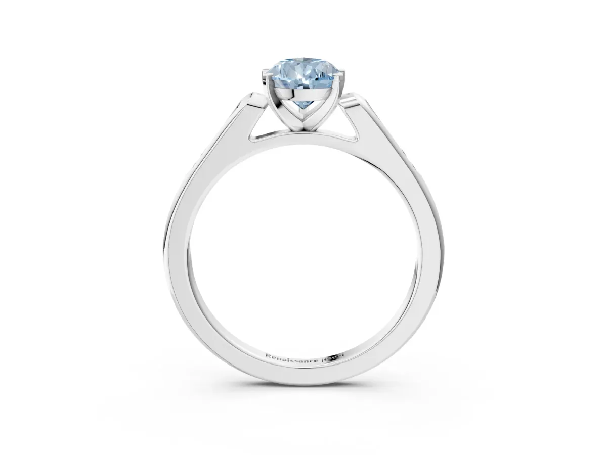 Fancy Blue Pear Cut Diamond Solitaire Ring with Channel Set Round Band and Prong Setting Silver