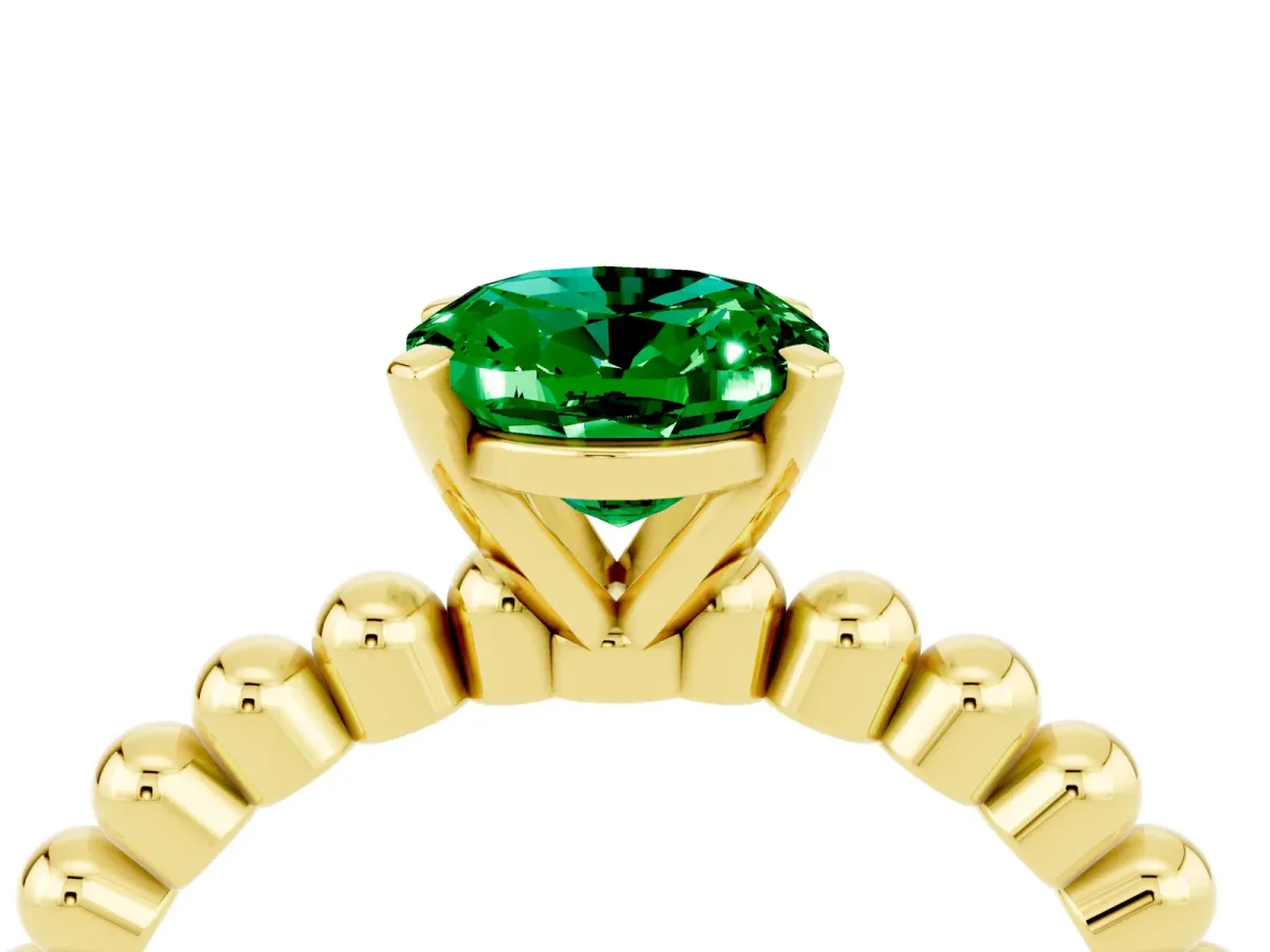 Oval Cut Emerald Solitaire Ring with Beaded Band and Prong Setting Yellow gold