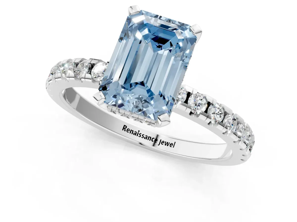 Fancy Blue Emerald Cut Diamond Solitaire Ring with Round Pavé Band and Four-Prong Setting Silver
