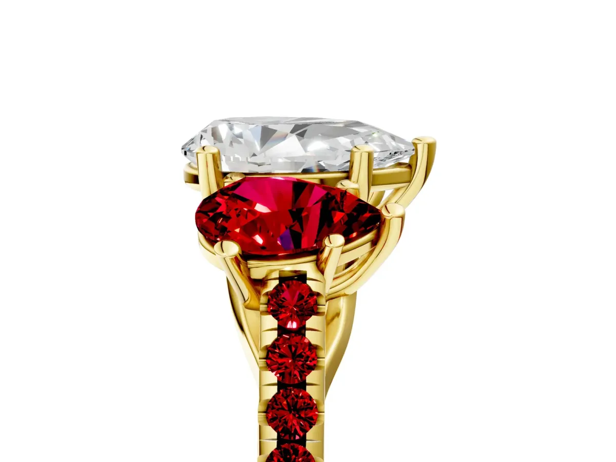 Three-Stone Pear Cut Diamond Ring with Round Ruby Pavé Band and Prong Setting Yellow gold