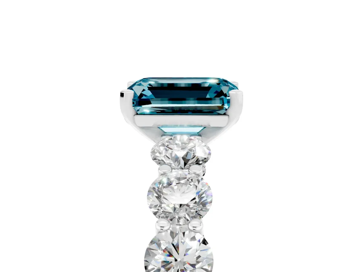 Emerald Cut Blue Topaz Prong Setting with Side Stones on a Pave Band Silver
