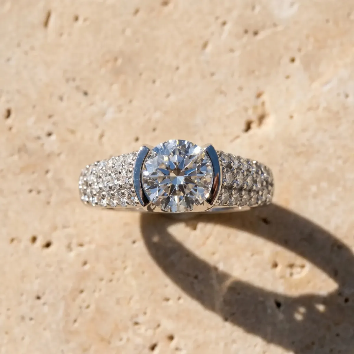 Round Cut Cut Diamond Channel Set Pave Band with Tension Prong Setting Silver