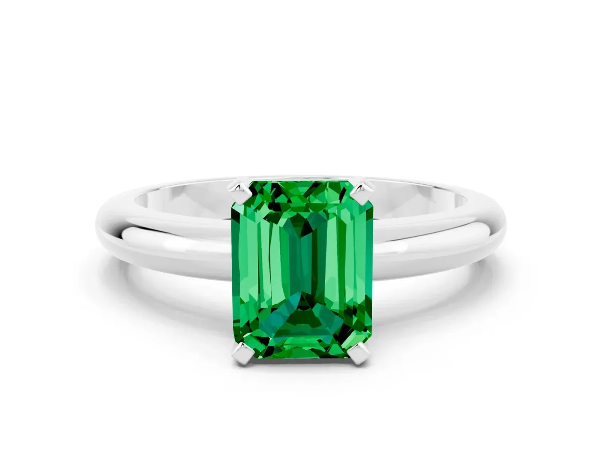 Emerald Cut Emerald Solitaire Engagement Ring with Round Band and Four-Prong Setting Silver