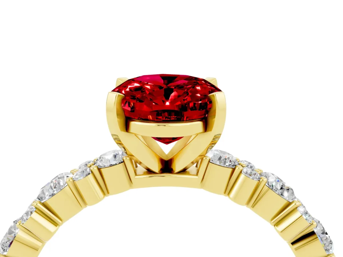 Oval Cut Ruby Side Stone Solitaire Ring with Round and Four-Prong Setting Yellow gold