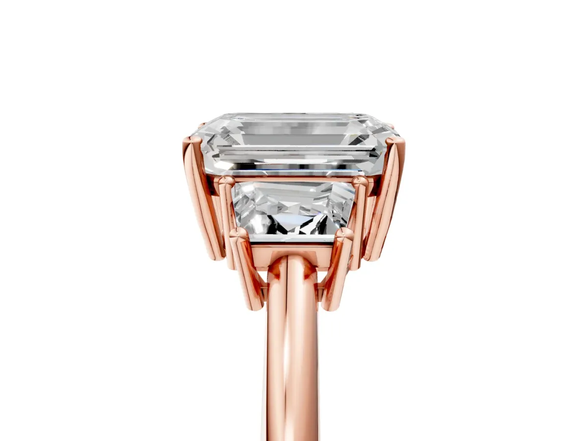 Emerald Cut Diamond Three-Stone Ring with Trapezoid Side Stones and Prong Setting Rose gold