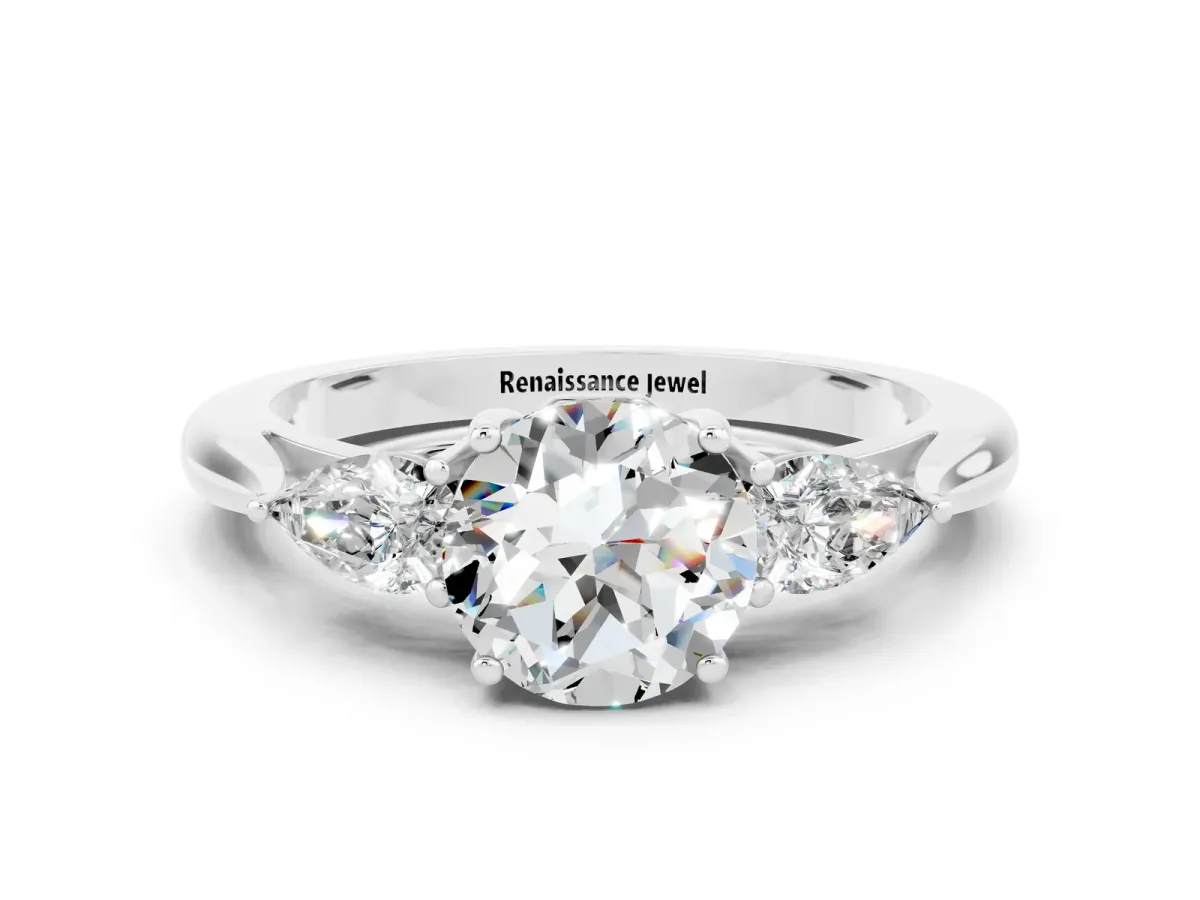 Three-Stone Round Cut Moissanite Ring with Pear Side Stones in Four-Prong Setting Platinum