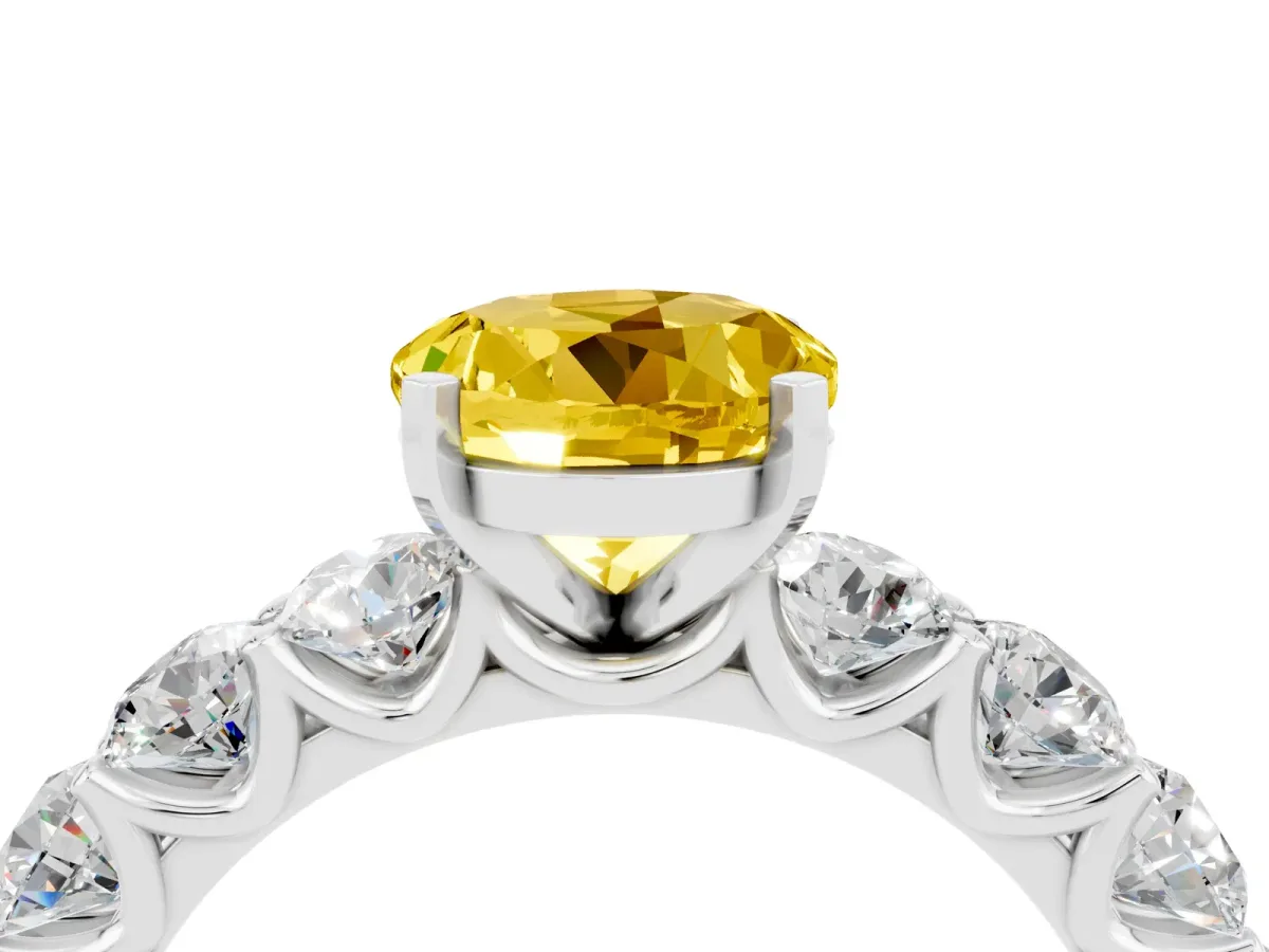 Round Cut Yellow Sapphire Prong Setting with Side Stones on a Pave Band Silver