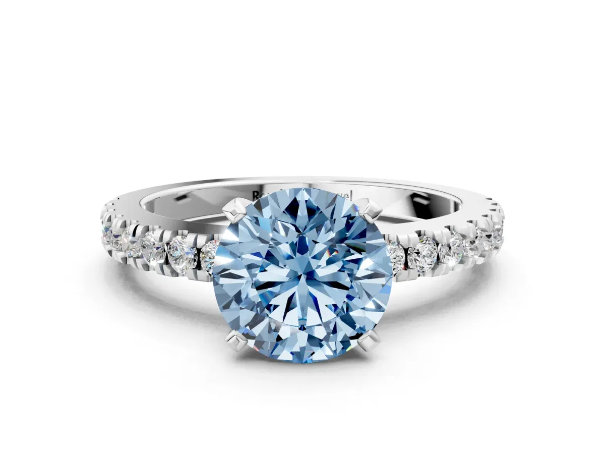 Fancy Blue Round Cut Solitaire Diamond with Pavé Band and Four-Prong Setting Silver