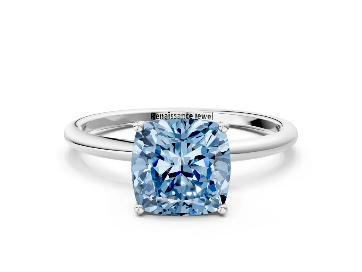 Fancy Blue Cushion Cut Cut Solitaire Engagement Ring with Thin Band and Four-Prong Setting Silver