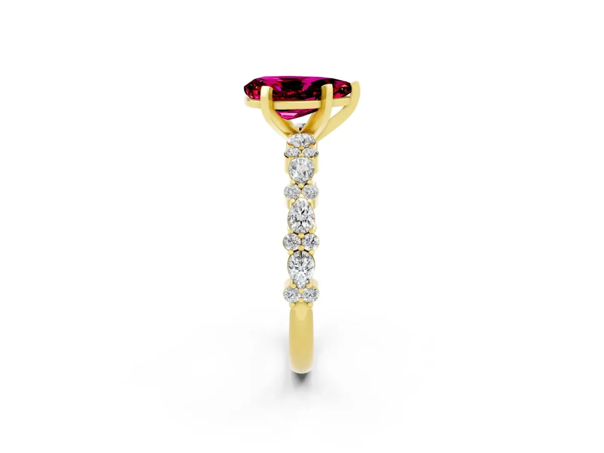 Pear Cut Garnet Side Stone Solitaire Ring with Round and Four-Prong Setting Yellow gold