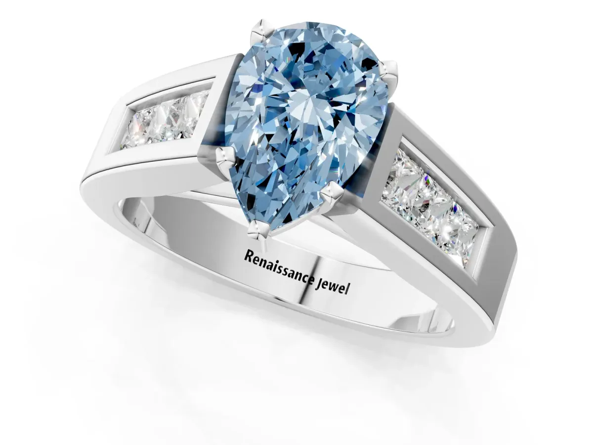Fancy Blue Pear Cut Cut Channel Set Solitaire Ring with Four-Prong Setting Silver
