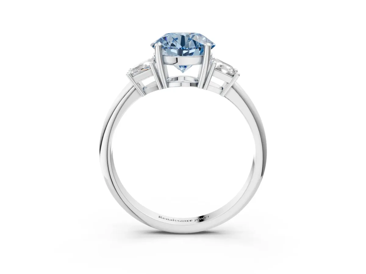 Fancy Blue Round Cut Diamond Three-Stone Ring with Trapezoid Side Stones and Prong Setting White gold