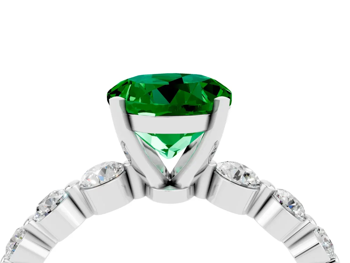 Round Cut Solitaire Emerald Ring with Pave Band and Four-Prong Setting Platinum