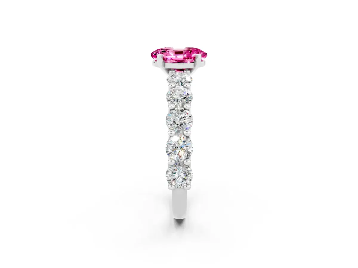 Oval Cut Pink Sapphire Prong Setting with Side Stones on a Pave Band Silver