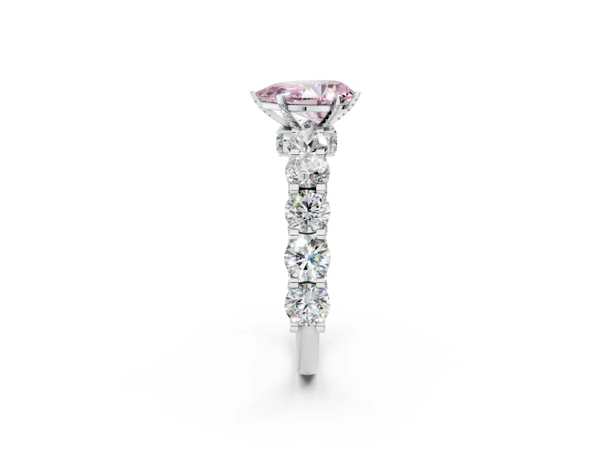 Fancy Pink Pear Cut Diamond Side Stone Engagement Ring with Four-Prong Setting Platinum