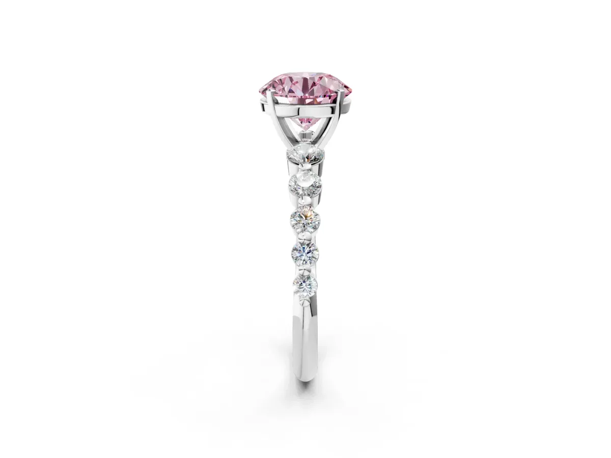 Fancy Pink Round Cut Solitaire Diamond Ring with Pave Band and Four-Prong Setting Silver
