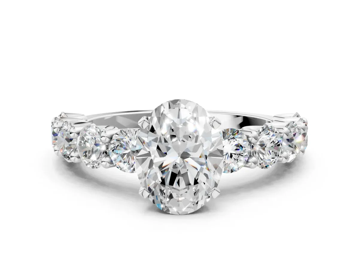 Oval Cut Diamond Prong Setting with Side Stones on a Pave Band White gold