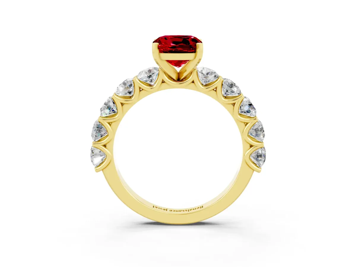 Cushion Cut Ruby Prong Setting with Side Stones on a Pave Band Yellow gold