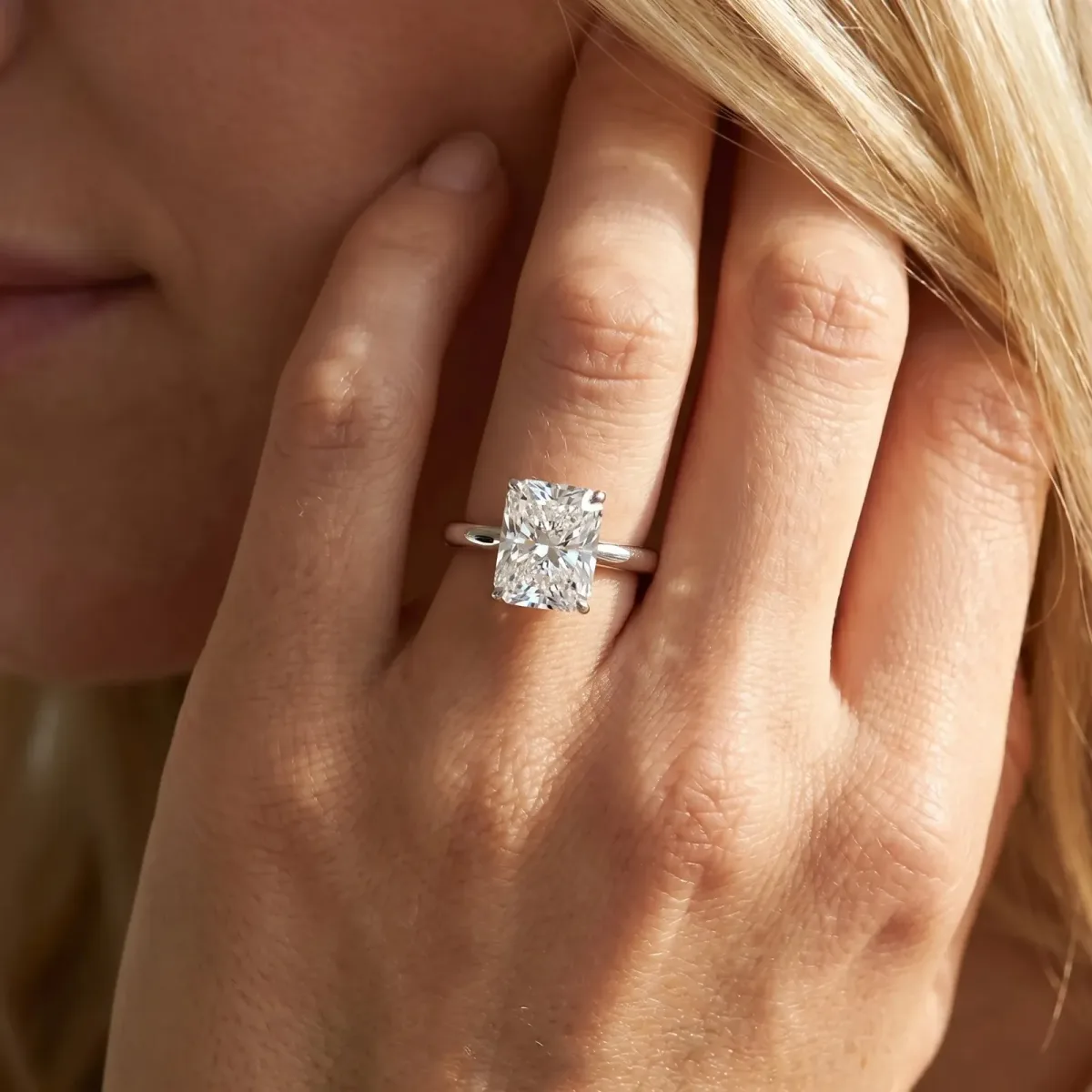 Radiant Cut Cut Solitaire Ring with Cathedral Band and Four-Prong Setting Platinum