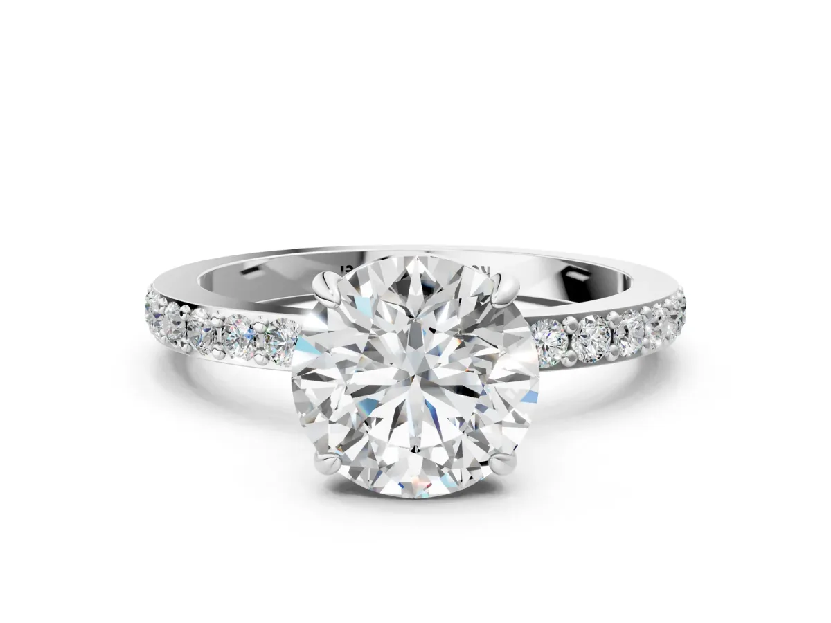 Round Cut Diamond Solitaire Engagement Ring with Pavé Band and Four-Prong Setting Silver