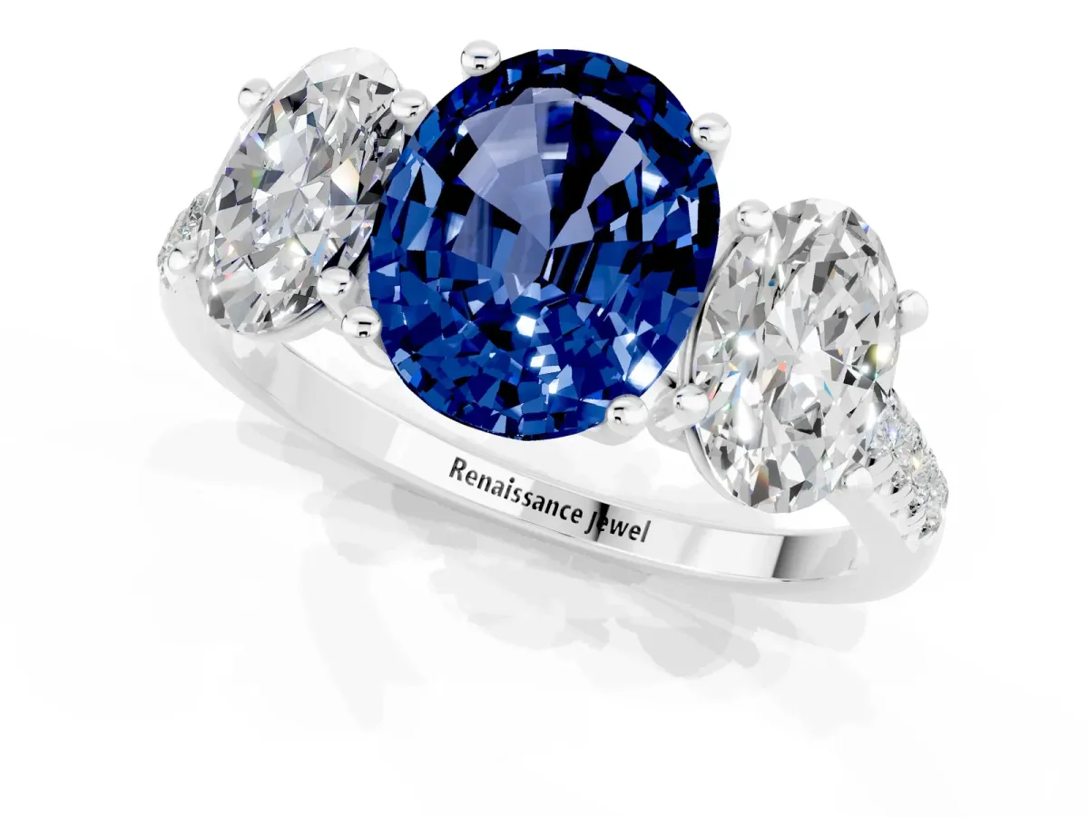 Three-Stone Oval Cut Blue Sapphire Ring with Round Pavé Band and Prong Setting Silver