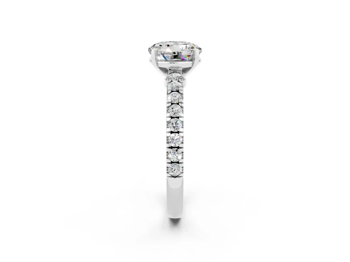 Round Cut Solitaire Moissanite with Pavé Band and Four-Prong Setting Silver