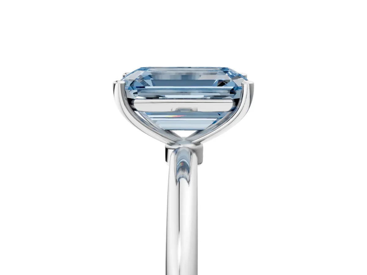 Fancy Blue Emerald Cut Cut Solitaire Engagement Ring with Thin Band and Four-Prong Setting Silver