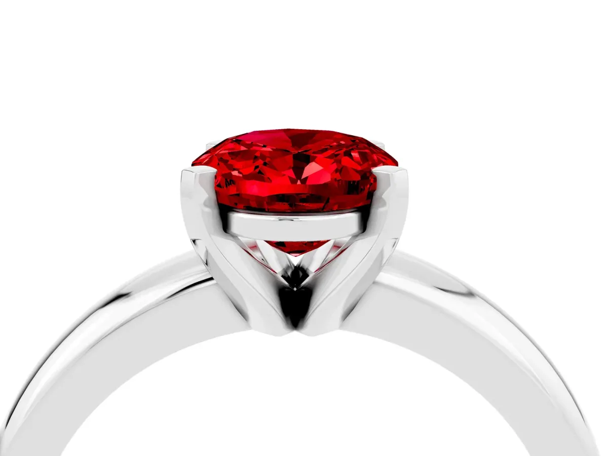 Oval Cut Ruby Solitaire Engagement Ring with Round Band and Four-Prong Setting Silver