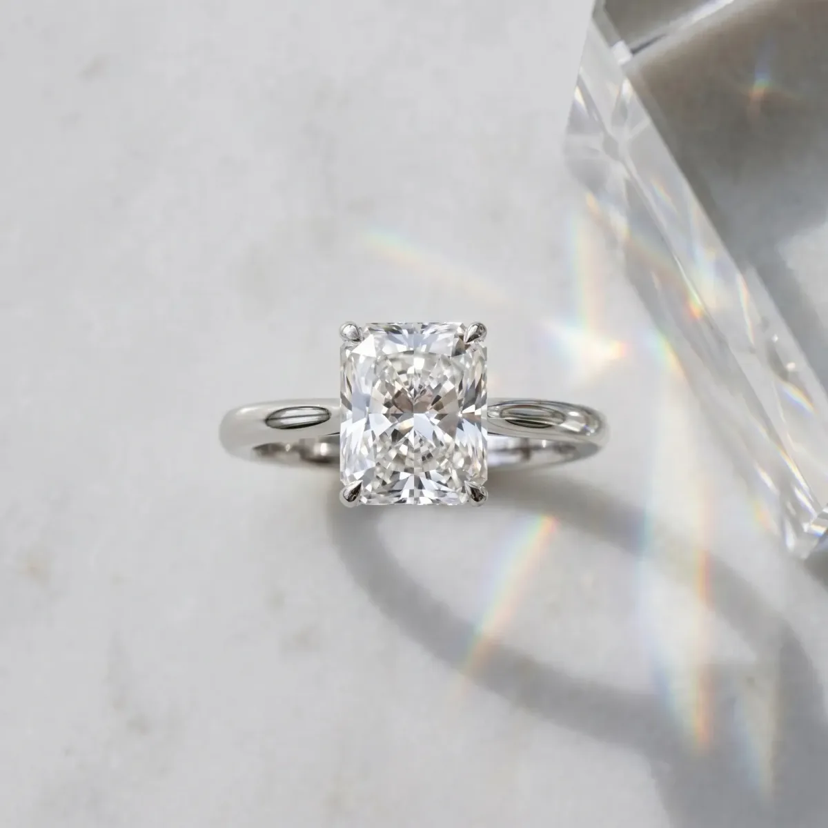 Radiant Cut Cut Solitaire Ring with Cathedral Band and Four-Prong Setting Platinum