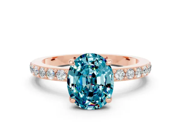 Oval Cut Blue Topaz Solitaire Engagement Ring with Pavé Band and Four-Prong Setting Rose gold