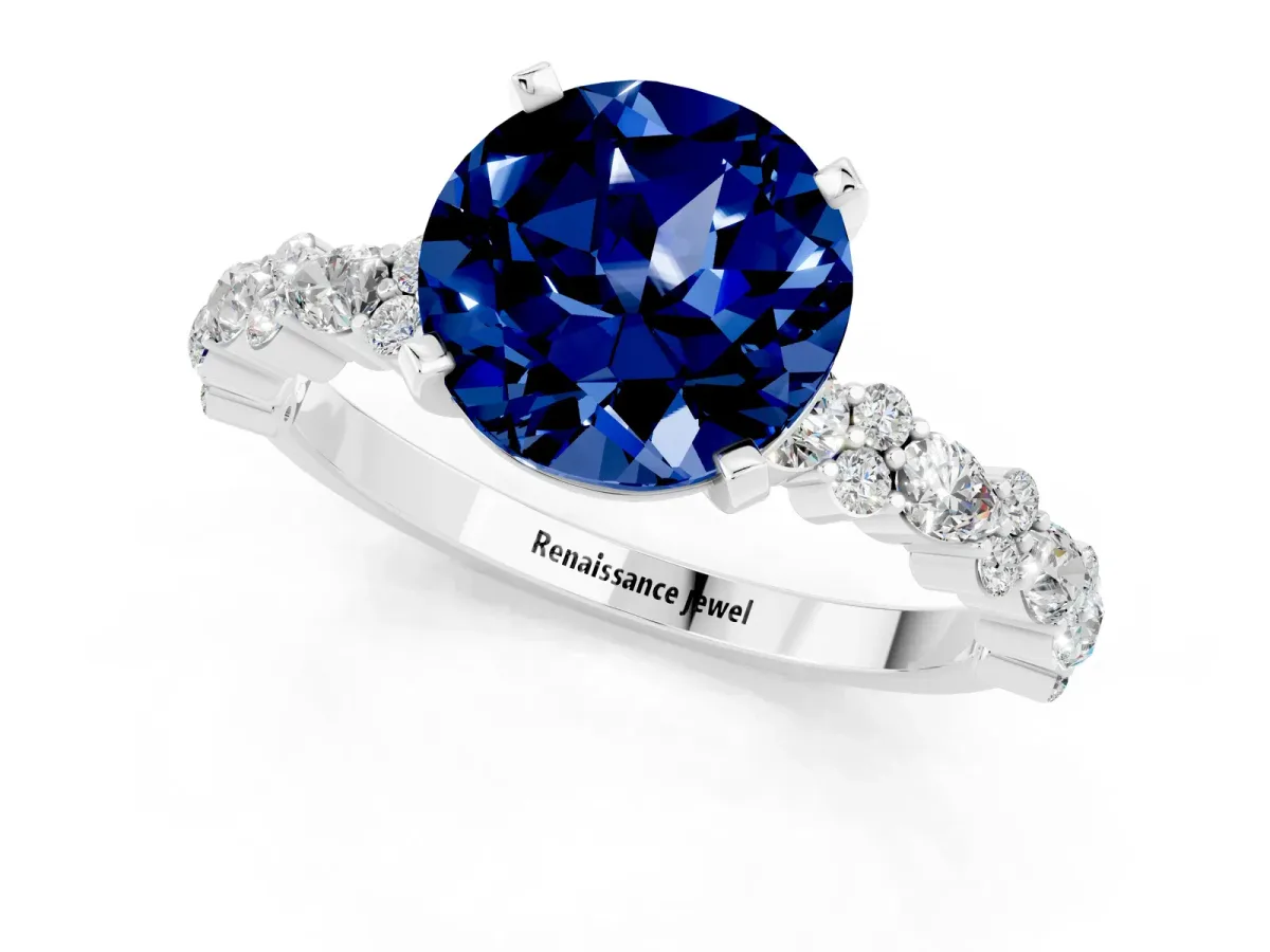 Round Cut Blue Sapphire Side Stone Solitaire Ring with Round and Four-Prong Setting Platinum