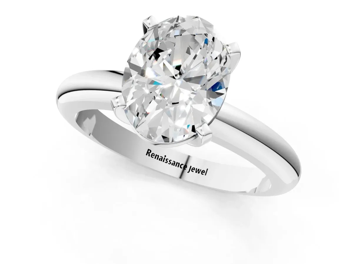 Oval Cut Diamond Solitaire Engagement Ring with Round Band and Four-Prong Setting Silver