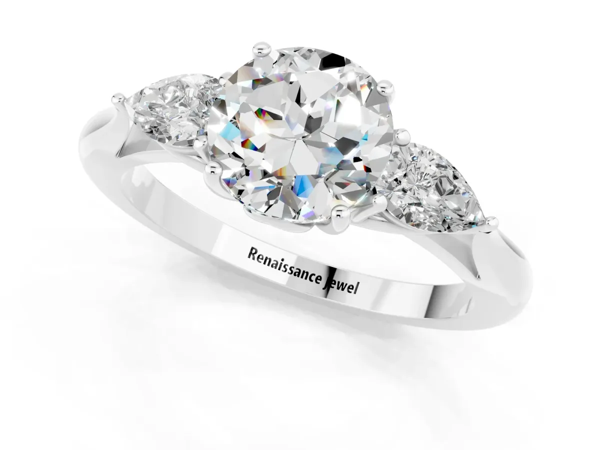 Three-Stone Round Cut Moissanite Ring with Pear Side Stones in Four-Prong Setting Platinum