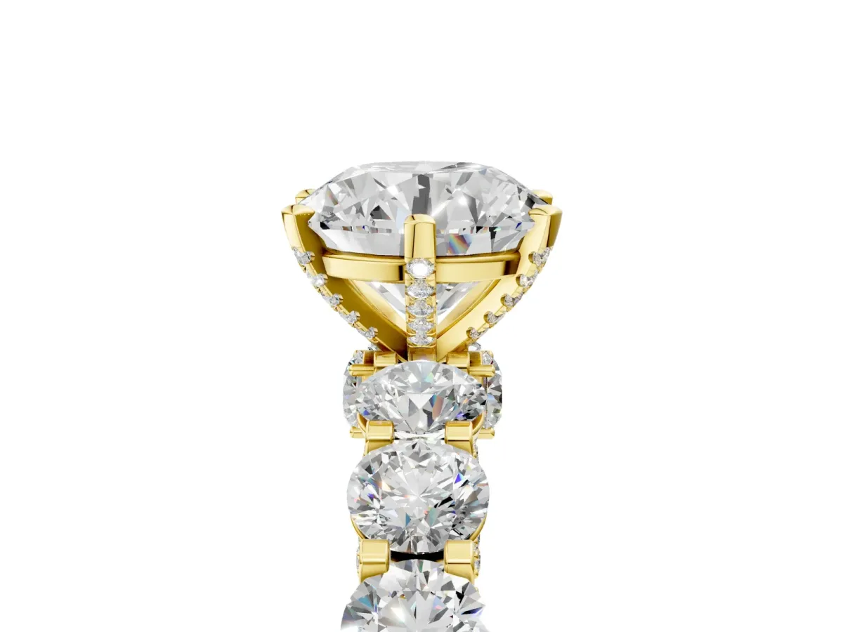 Round Cut Diamond Side Stone Engagement Ring with Four-Prong Setting Yellow gold