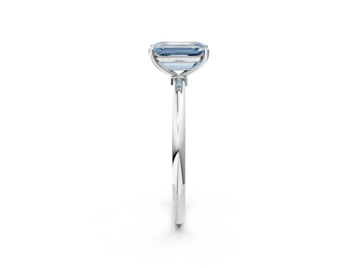 Fancy Blue Emerald Cut Cut Solitaire Engagement Ring with Thin Band and Four-Prong Setting Silver
