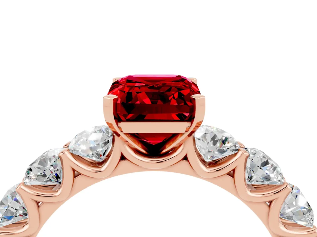 Emerald Cut Ruby Prong Setting with Side Stones on a Pave Band Rose gold