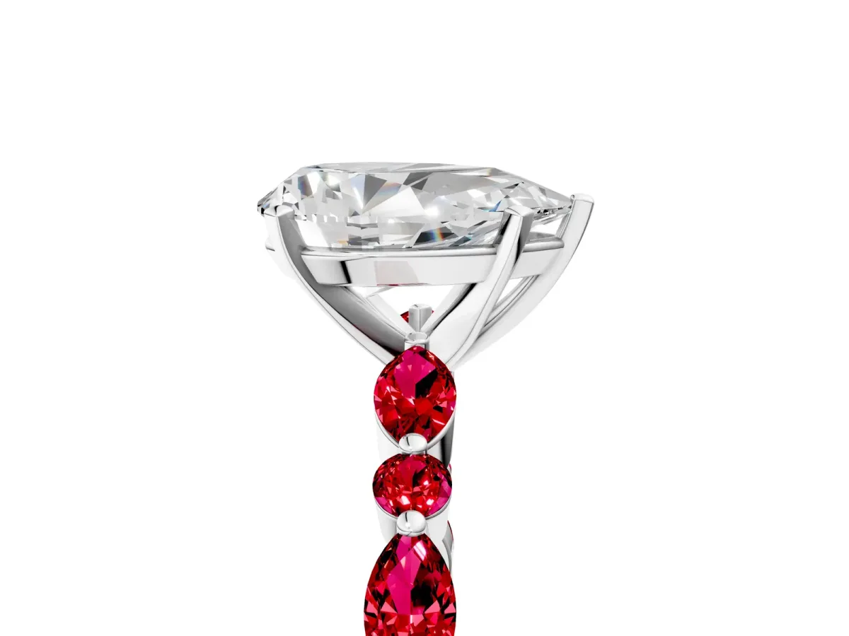 Pear Cut Diamond Ring with Marquise and Round Ruby Side Stones and Four-Prong Setting Platinum