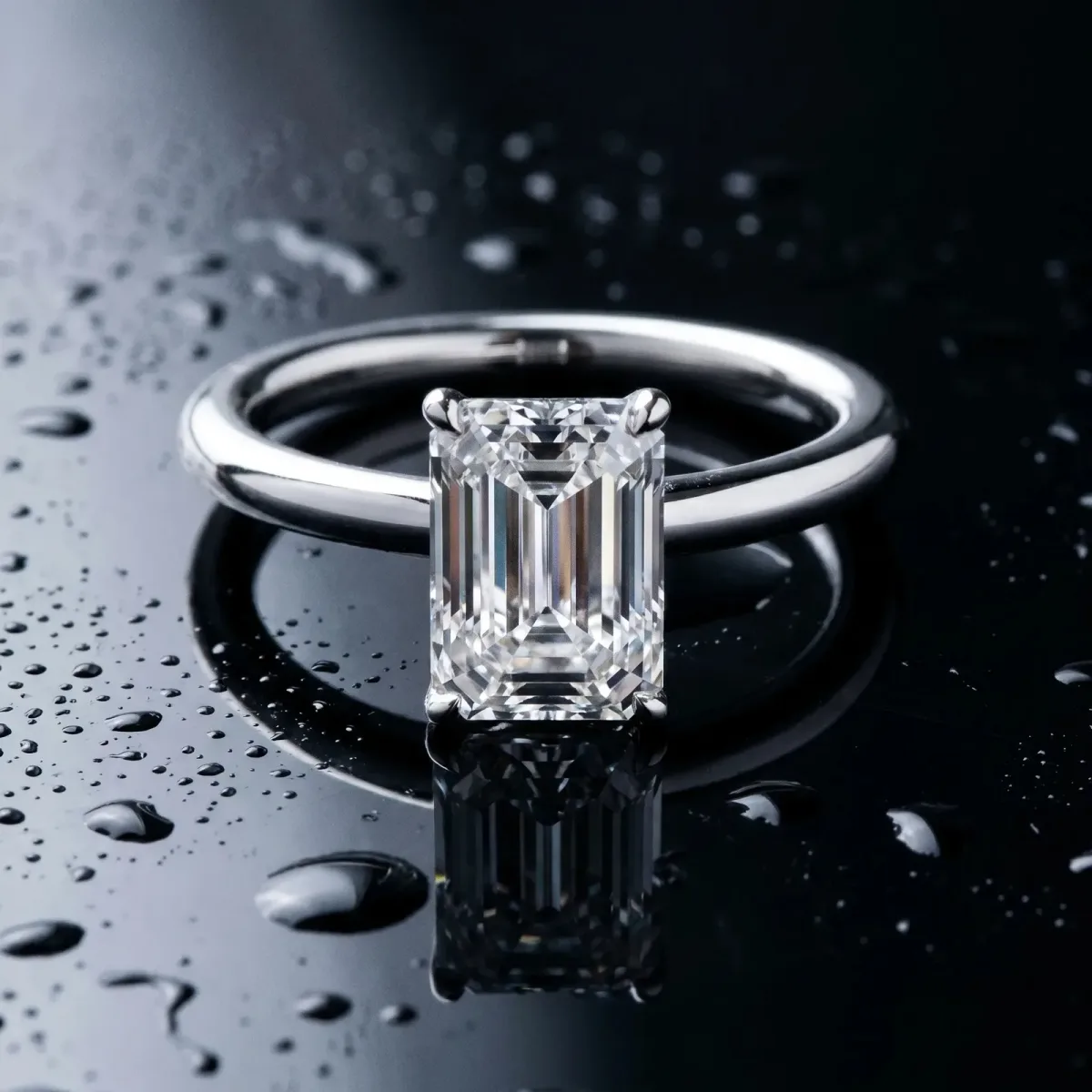 Emerald Cut Diamond Solitaire Ring with Thin Band and Four-Prong Setting White gold