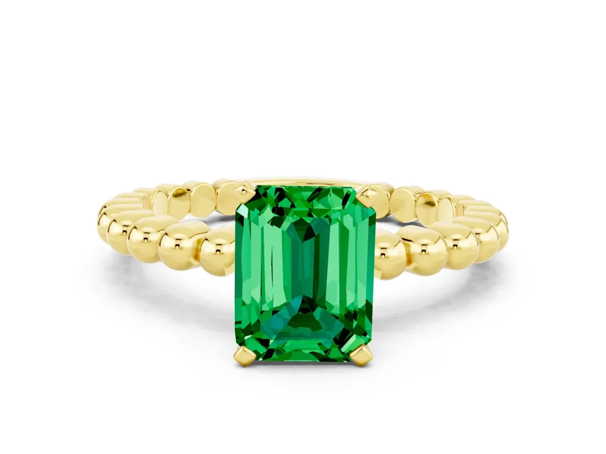 Emerald Cut Emerald Solitaire Ring with Beaded Band and Prong Setting Yellow gold