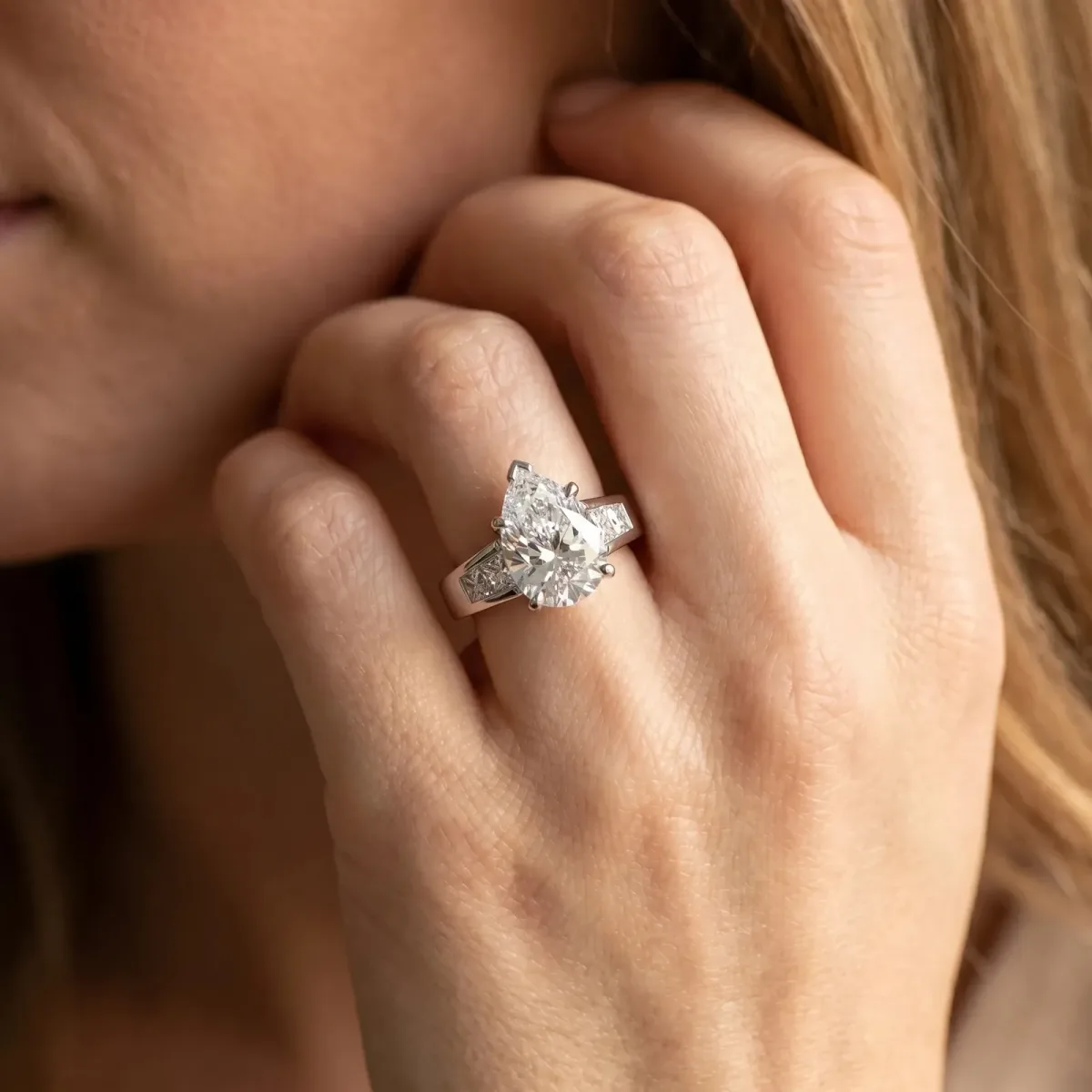 Pear Cut Cut Channel Set Solitaire Ring with Four-Prong Setting Platinum