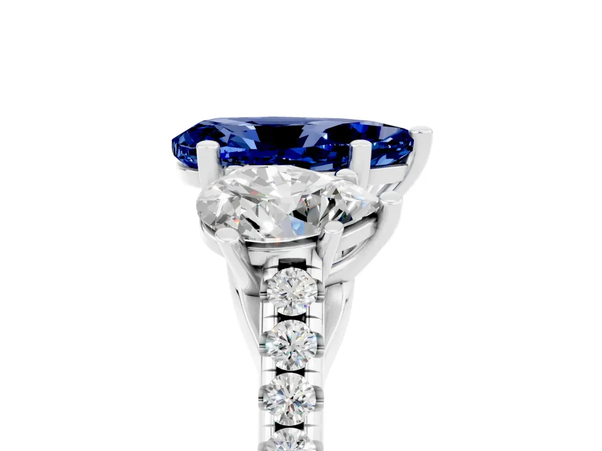 Three-Stone Pear Cut Blue Sapphire Ring with Round Pavé Band and Prong Setting Silver