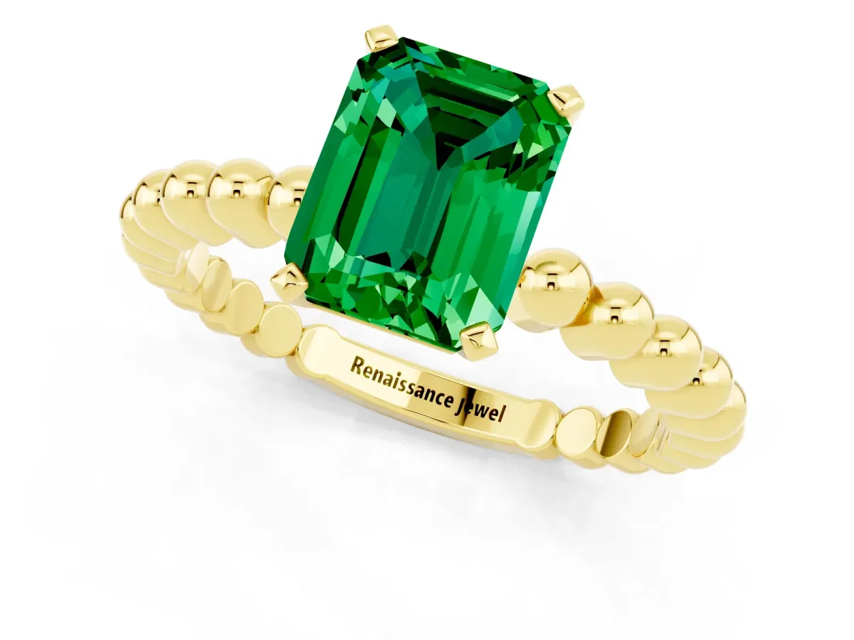 Emerald Cut Emerald Solitaire Ring with Beaded Band and Prong Setting Yellow gold