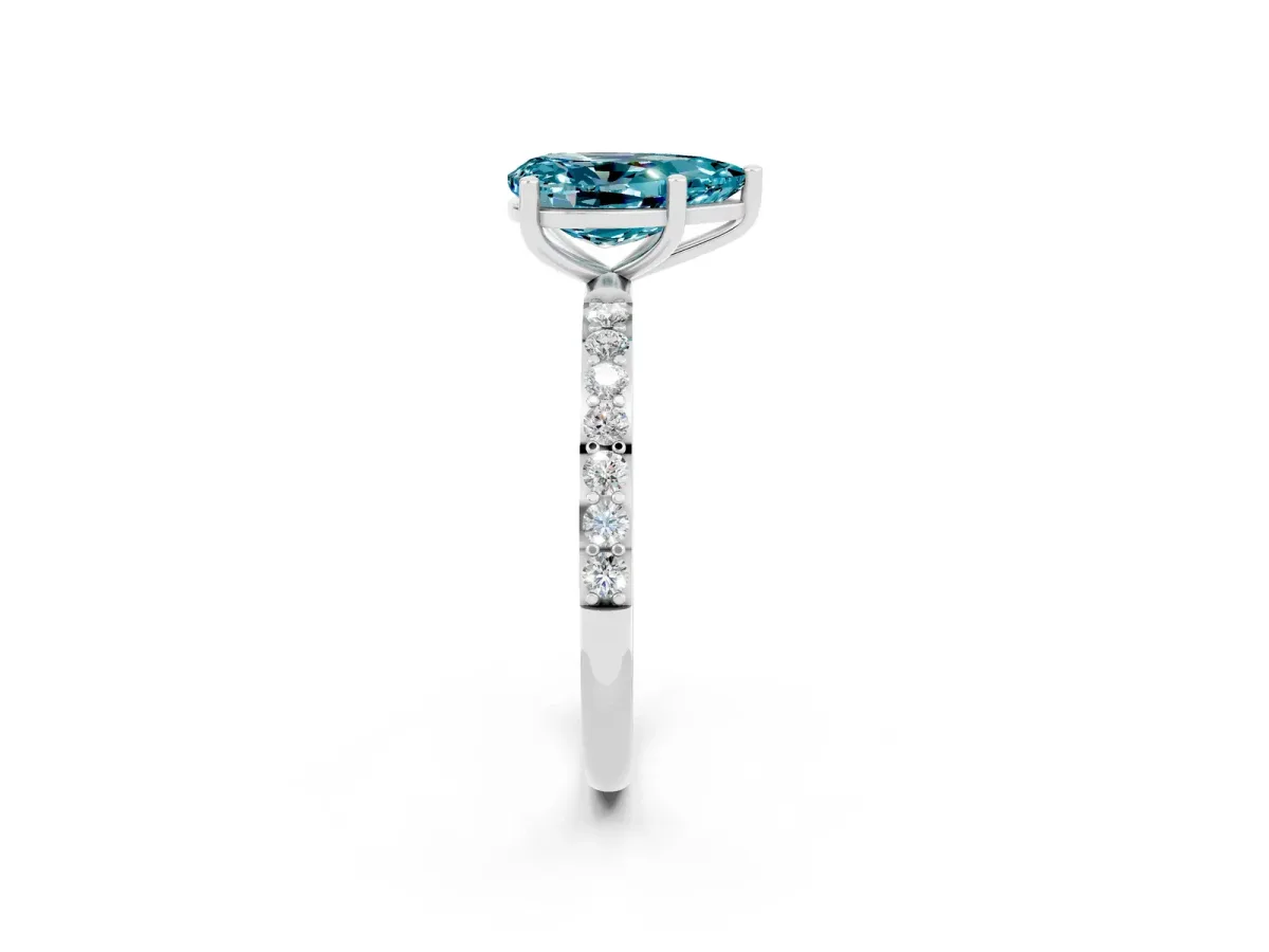 Pear Cut Blue Topaz Solitaire Ring with Round Pavé Band and Prong Setting Silver