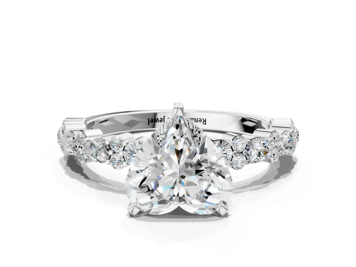 Heart Cut Diamond Side Stone Solitaire Ring with Round and Four-Prong Setting White gold