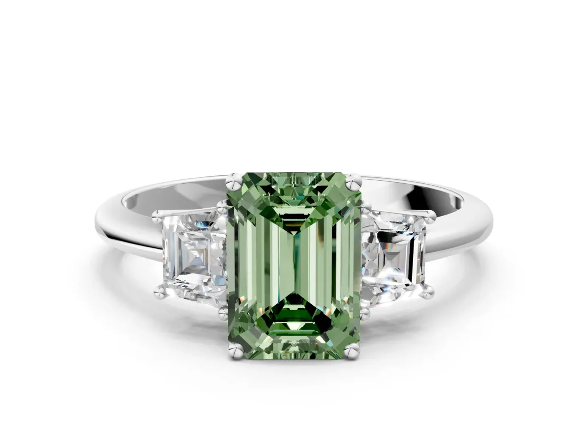 Fancy Green Emerald Cut Diamond Three-Stone Ring with Trapezoid Side Stones and Prong Setting Silver